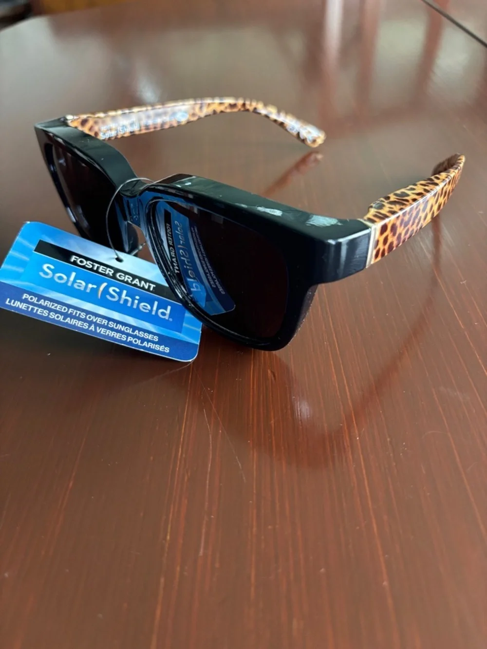 Foster Grant Solar Shield polarized,tortoise shell leopard arms,black frame/lens